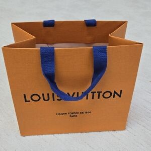 LOUIS VUITTON • Orange Gift Bag with Blue Handles